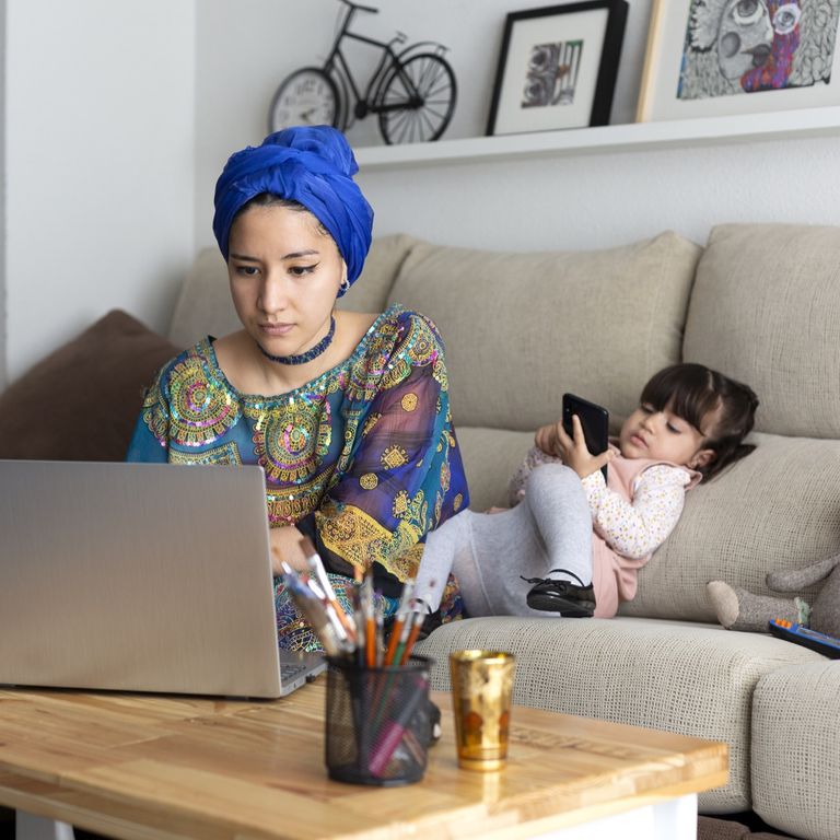 Young mother and her daughter on a computer