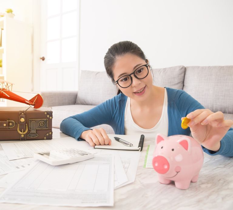 A young woman saving money on her building insurance.