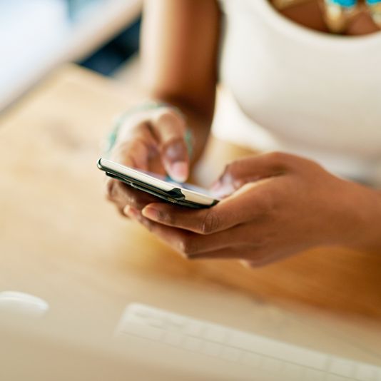 A woman working on her phone.